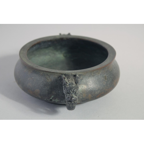 146 - A CHINESE BRONZE TWIN HANDLE CENSER, the handles formed as dragon heads, character mark to base, 18c... 