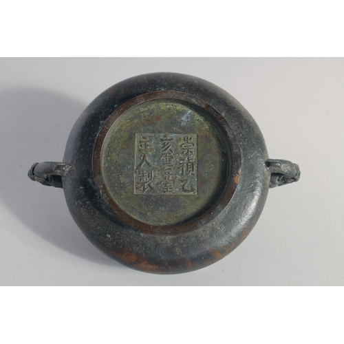 146 - A CHINESE BRONZE TWIN HANDLE CENSER, the handles formed as dragon heads, character mark to base, 18c... 