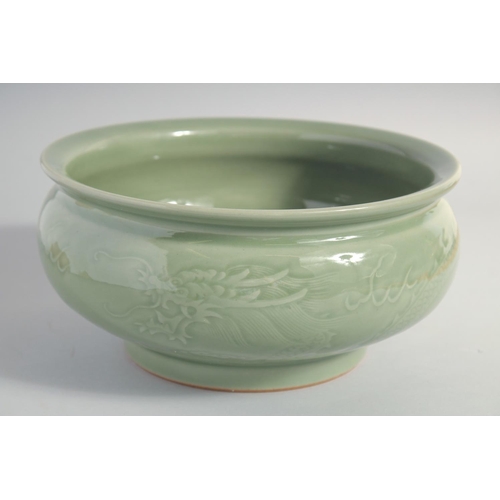 153 - A LARGE CHINESE CELADON GLAZE BOWL, carved with dragon and the flaming pearl of wisdom, 25.5cm diame... 