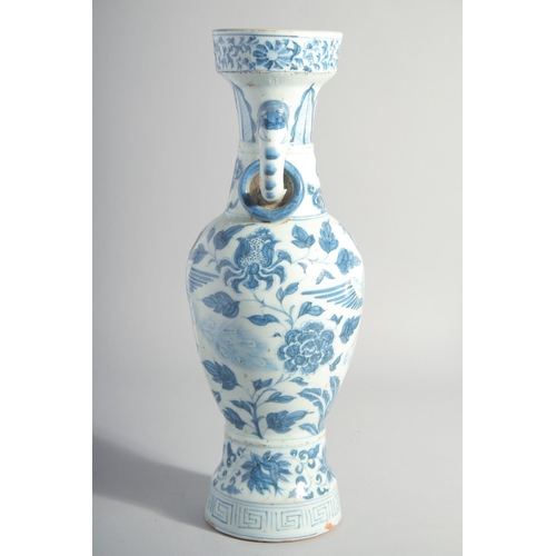 160 - A CHINESE YUAN STYLE BLUE AND WHITE GLAZED POTTERY TWIN HANDLE VASE, painted with birds and flora, 3... 