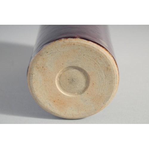 164 - A CHINESE IRON RED GLAZE CYLINDRICAL BRUSH POT, 15cm high.