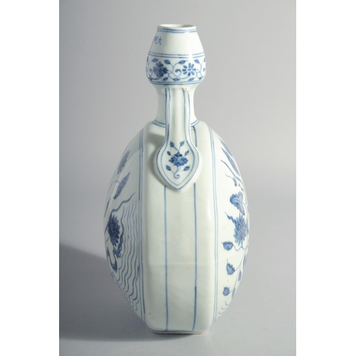 174 - A CHINESE BLUE AND WHITE PORCELAIN TWIN HANDLE MOON FLASK, decorated with a central spray of flora, ... 