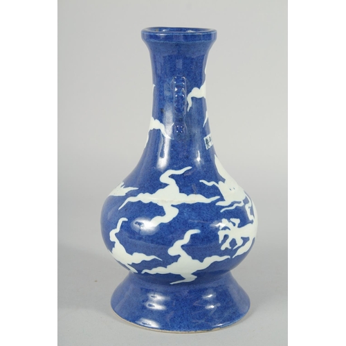 181 - A CHINESE SACRIFICIAL BLUE AND WHITE TWIN HANDLE DRAGON VASE, 29cm high.