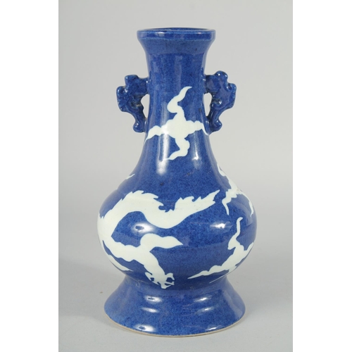 181 - A CHINESE SACRIFICIAL BLUE AND WHITE TWIN HANDLE DRAGON VASE, 29cm high.