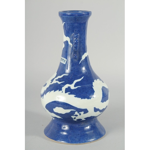 181 - A CHINESE SACRIFICIAL BLUE AND WHITE TWIN HANDLE DRAGON VASE, 29cm high.