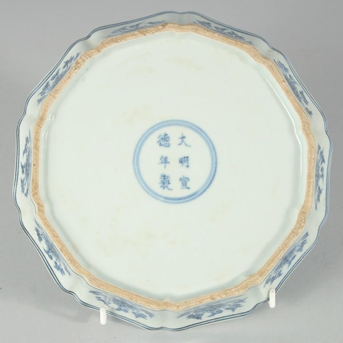 182 - A CHINESE BLUE AND WHITE PORCELAIN PETAL FORM BOWL, the interior with central floral spray, exterior... 