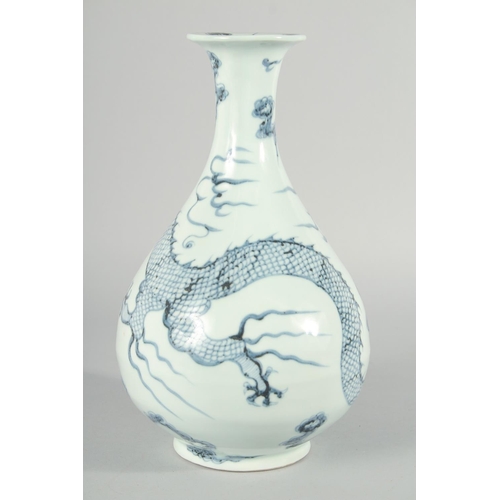 183 - A CHINESE BLUE AND WHITE PORCELAIN YUHUCHUNPIN VASE, painted with a large dragon, 31.5cm high.