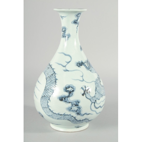 183 - A CHINESE BLUE AND WHITE PORCELAIN YUHUCHUNPIN VASE, painted with a large dragon, 31.5cm high.