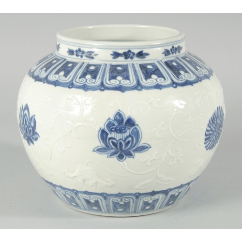 189 - A CHINESE BLUE AND WHITE PORCELAIN JAR, decorated with flower heads and carved leaves, bearing six-c... 