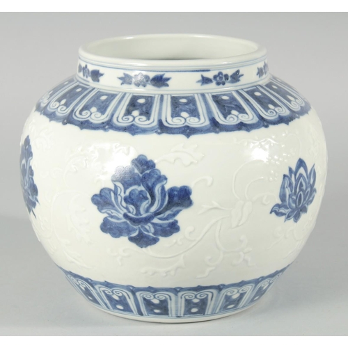 189 - A CHINESE BLUE AND WHITE PORCELAIN JAR, decorated with flower heads and carved leaves, bearing six-c... 