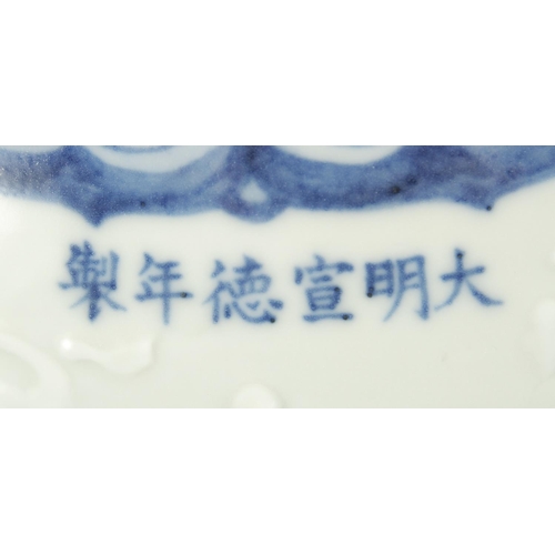 189 - A CHINESE BLUE AND WHITE PORCELAIN JAR, decorated with flower heads and carved leaves, bearing six-c... 