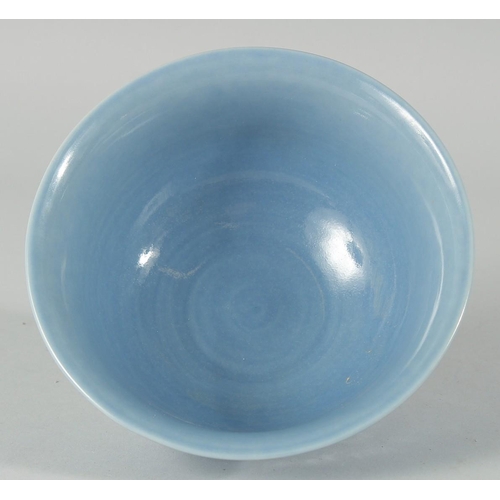 193 - A CHINESE POWDER BLUE GLAZE PORCELAIN BOWL, the exterior with carved dragon, six-character mark to b... 