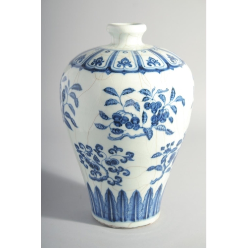 194 - A CHINESE MING STYLE BLUE AND WHITE MEIPING VASE, decorated with various blossoming fruit, 29cm high... 