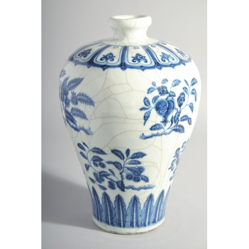 194 - A CHINESE MING STYLE BLUE AND WHITE MEIPING VASE, decorated with various blossoming fruit, 29cm high... 