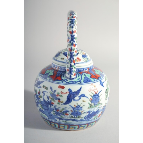 195 - A CHINESE MING STYLE DOUCAI PORCELAIN TEAPOT, painted with cranes and flora, base with six-character... 