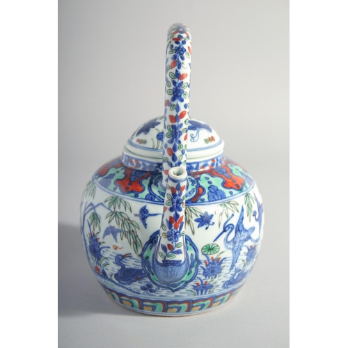 195 - A CHINESE MING STYLE DOUCAI PORCELAIN TEAPOT, painted with cranes and flora, base with six-character... 