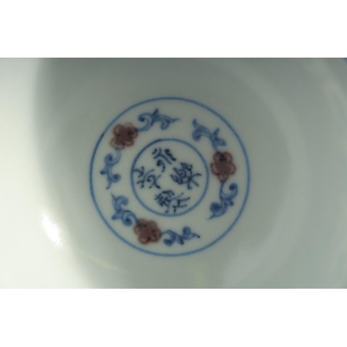 196 - A CHINESE MING STYLE BLUE, WHITE AND UNDERGLAZE RED PEDESTAL CUP, the interior with four-character m... 