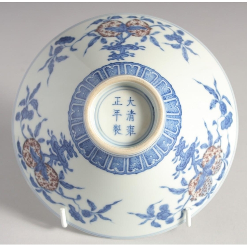 200 - A CHINESE BLUE, WHITE AND UNDERGLAZE RED PORCELAIN BOWL, painted with pomegranate, 16cm diameter.