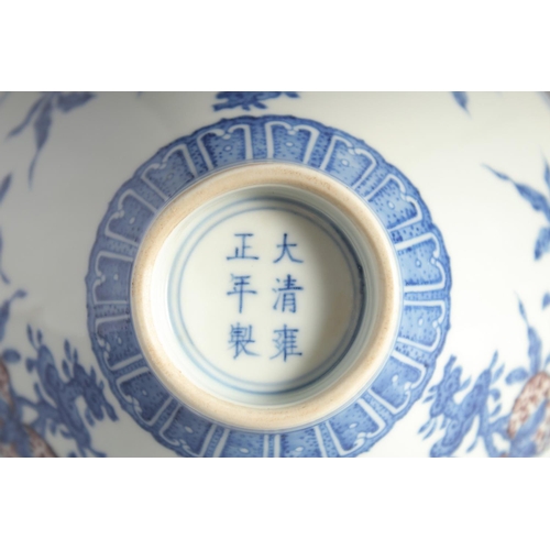 200 - A CHINESE BLUE, WHITE AND UNDERGLAZE RED PORCELAIN BOWL, painted with pomegranate, 16cm diameter.