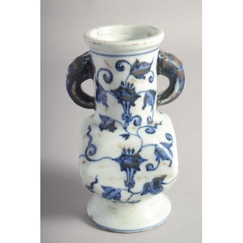 201 - A CHINESE BLUE AND WHITE PORCELAIN TWIN HANDLE VASE, six-character mark to base, 18cm high.