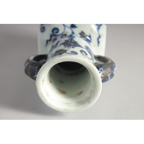 201 - A CHINESE BLUE AND WHITE PORCELAIN TWIN HANDLE VASE, six-character mark to base, 18cm high.