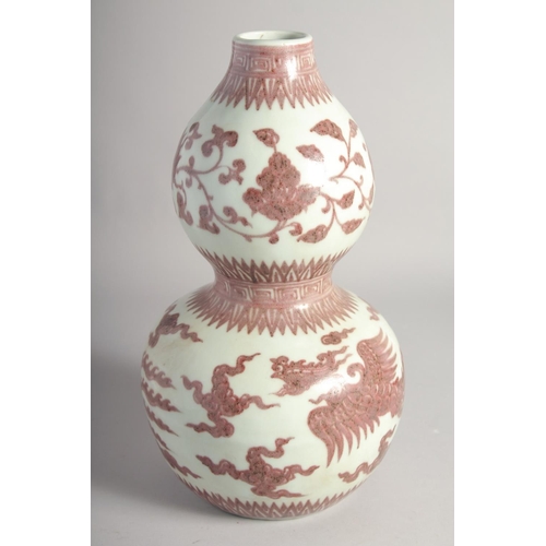 203 - A CHINESE UNDERGLAZE RED AND WHITE DOUBLE GOURD VASE, decorated with phoenix, six-character mark, 34... 