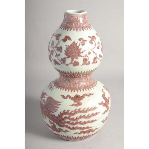 203 - A CHINESE UNDERGLAZE RED AND WHITE DOUBLE GOURD VASE, decorated with phoenix, six-character mark, 34... 