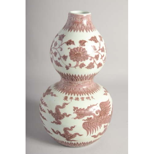 203 - A CHINESE UNDERGLAZE RED AND WHITE DOUBLE GOURD VASE, decorated with phoenix, six-character mark, 34... 