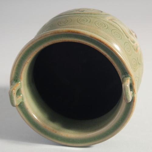 212 - A CHINESE LONGQUAN CELADON TRIPOD CENSER, with carved foliate decoration, 15.5cm high.