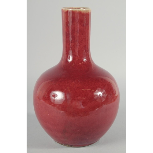 226 - A CHINESE COPPER RED GLAZE VASE, 32cm high.