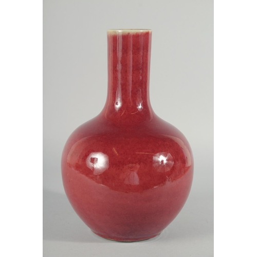 226 - A CHINESE COPPER RED GLAZE VASE, 32cm high.