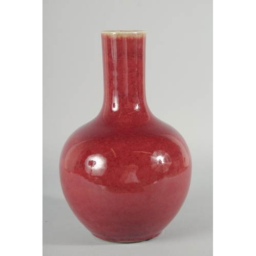 226 - A CHINESE COPPER RED GLAZE VASE, 32cm high.