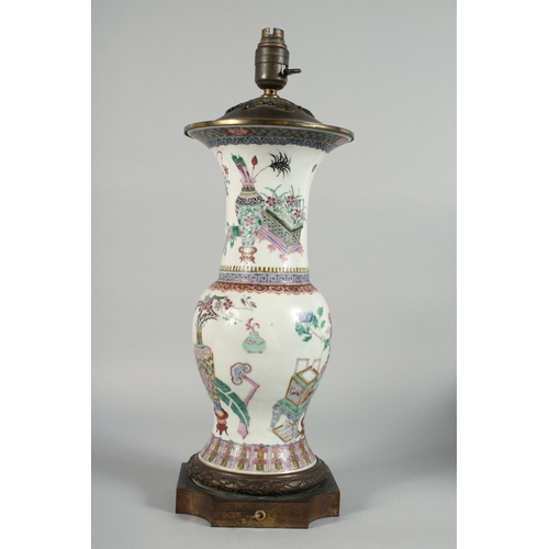 231 - A LARGE CHINESE FAMILLE ROSE PORCELAIN VASE LAMP, the body painted with potted flowers, vases and ja... 