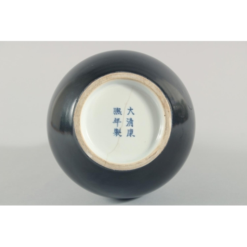 233 - A CHINESE FAMILLE NOIR PORCELAIN BOTTLE VASE, the base with six-character mark, 28.5cm high.