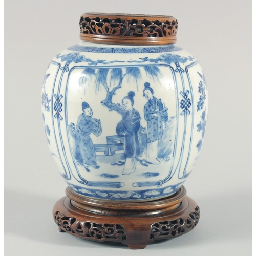 235 - A CHINESE BLUE AND WHITE PORCELAIN JAR, with a carved and pierced cover and stand, the jar painted w... 