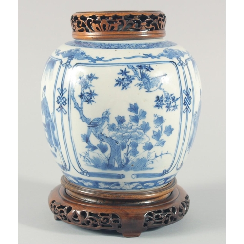 235 - A CHINESE BLUE AND WHITE PORCELAIN JAR, with a carved and pierced cover and stand, the jar painted w... 