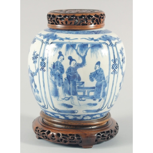 235 - A CHINESE BLUE AND WHITE PORCELAIN JAR, with a carved and pierced cover and stand, the jar painted w... 