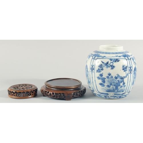 235 - A CHINESE BLUE AND WHITE PORCELAIN JAR, with a carved and pierced cover and stand, the jar painted w... 