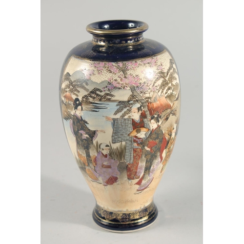 237 - TWO JAPANESE SATSUMA VASES, the larger painted with panels of figures in a landscape, each with char... 