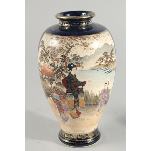 237 - TWO JAPANESE SATSUMA VASES, the larger painted with panels of figures in a landscape, each with char... 