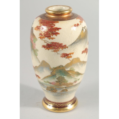 237 - TWO JAPANESE SATSUMA VASES, the larger painted with panels of figures in a landscape, each with char... 