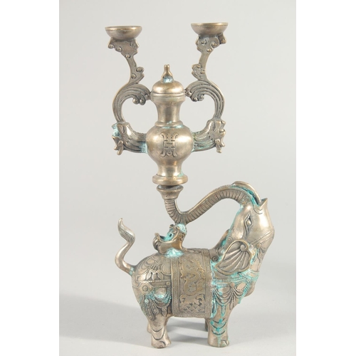 241 - A PAIR OF METAL ELEPHANT FORM CANDLESTICKS, 31cm high.