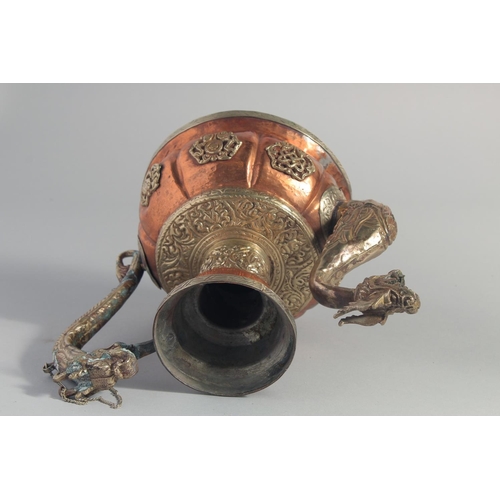 242 - A CHINESE COPPER LIDDED EWER, the spout and handle formed as dragons, 24.5cm high.