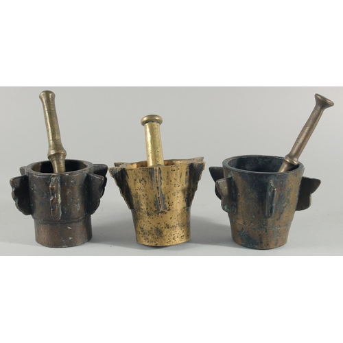 244 - A COLLECTION OF THREE EARLY BRONZE PESTLE AND MORTARS, (six pieces).