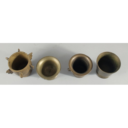 245 - A COLLECTION OF FOUR BRONZE PESTLE AND MORTARS, (eight pieces).