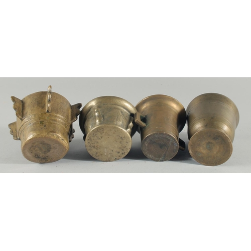 245 - A COLLECTION OF FOUR BRONZE PESTLE AND MORTARS, (eight pieces).