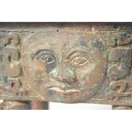 247 - AN UNUSUAL ARCHAIC BRONZE TWIN HANDLE CENSER, the rectangular form censer decorated with relief face... 