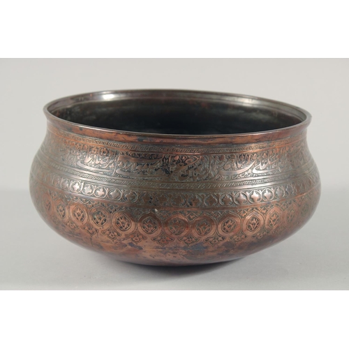 253 - A FINE LARGE 17TH CENTURY PERSIAN SAFAVID COPPER BOWL, engraved with a band of calligraphy and folia... 