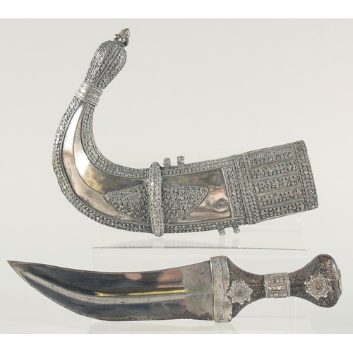 259 - A FINE LARGE 19TH CENTURY RHINO HORN HILTED ARAB YEMENITE SILVER JAMBIYA DAGGER, 34.5cm in sheath.