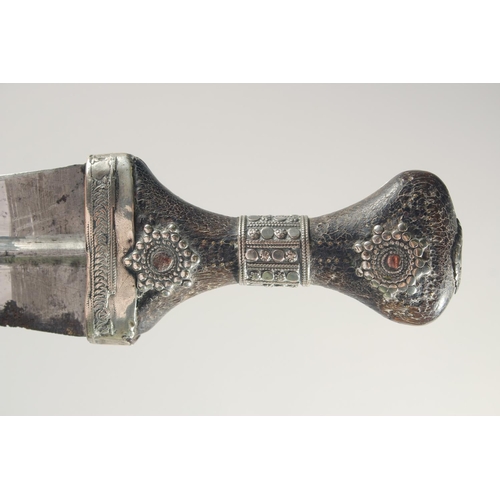 259 - A FINE LARGE 19TH CENTURY RHINO HORN HILTED ARAB YEMENITE SILVER JAMBIYA DAGGER, 34.5cm in sheath.